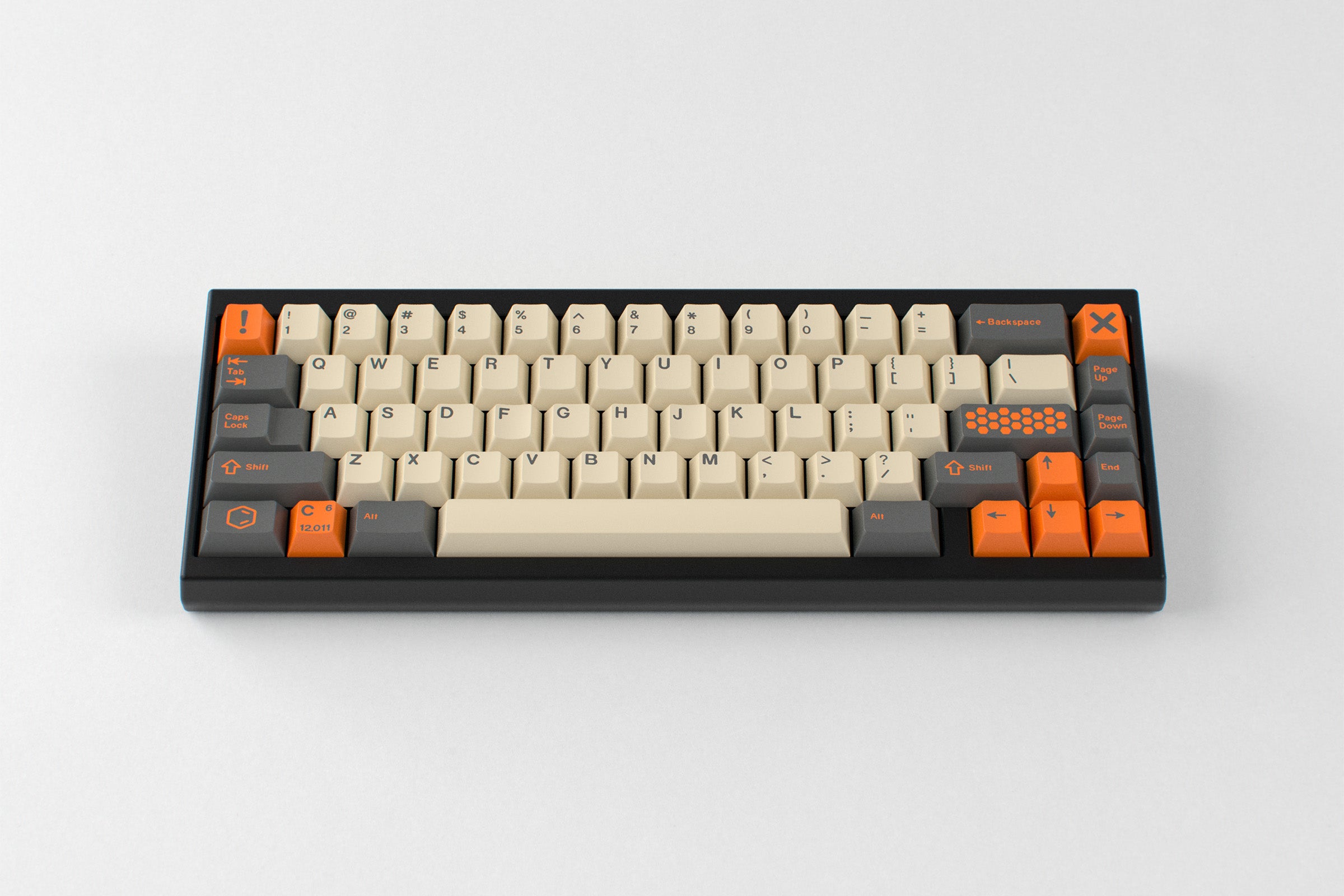 GMK CYL Carbon R3 installed on a compact keyboard, showing the exact beige alphas, dark gray modifiers and safety-orange accents